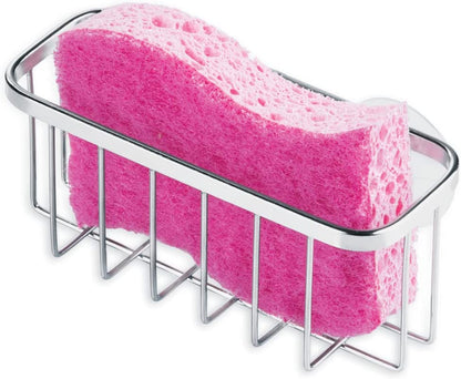 Polished steel sponge holder suctioned inside a kitchen sink