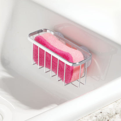 The holder with a sponge in it, draining clear of the worktop