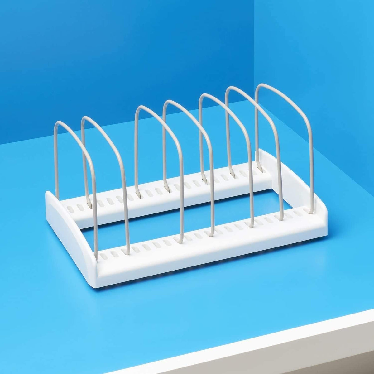 The empty rack, showing the slotted base and seven wire dividers