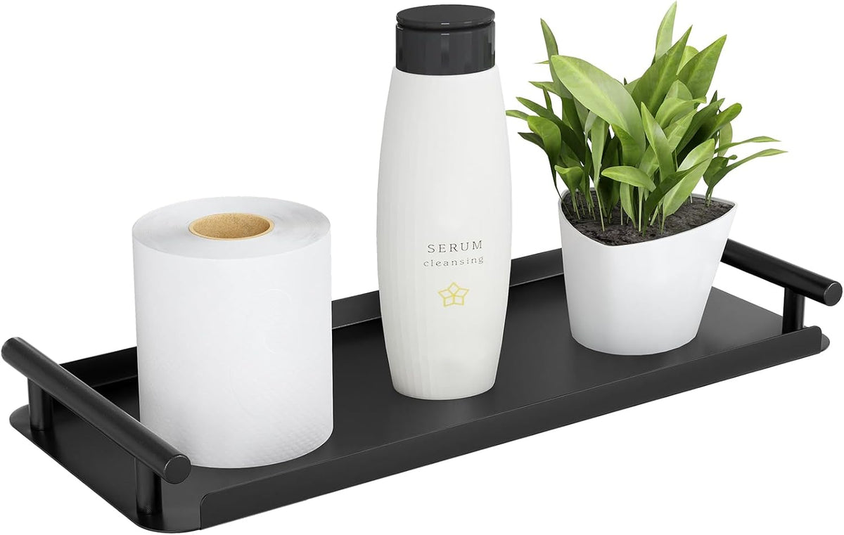 Black steel bathroom tray on a cistern lid holding a soap dispenser and a spare roll
