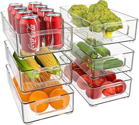 Six clear stackable fridge boxes in three sizes, holding cans, broccoli, corn, courgettes, oranges and apples