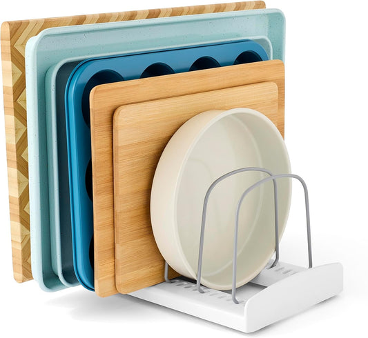 The rack holding chopping boards and a plate on edge