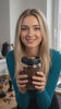 Short video: a thumb presses the brass button on top of the lid three times to pump the air out of the jar.
