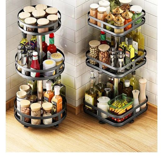 Round and square three-tier rotating spice racks filled with oils, sauces and spice jars in a kitchen corner